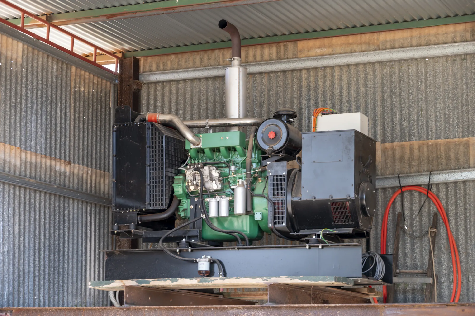 Welling & Crossley 100 kVA backup generator installed inside the on-site shed