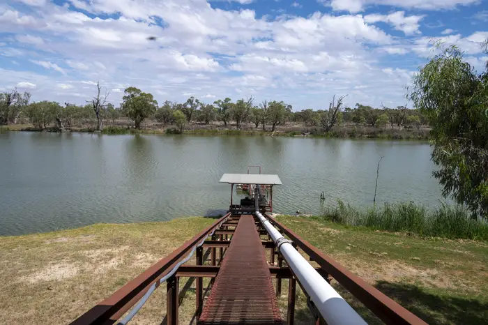 Steel pipeline and walkway running over Big Toolunka Creek to the pump intake