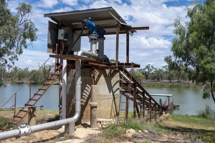 Elevated pump platform and delivery pipeline beside Big Toolunka Creek