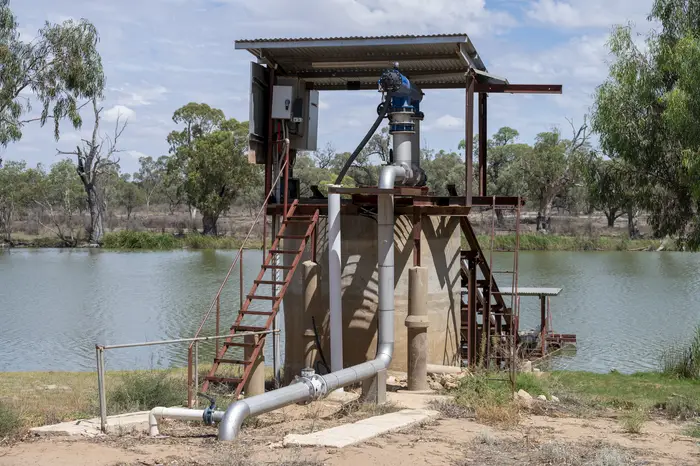 Pumping station structure with access stairs and pipework beside Big Toolunka Creek